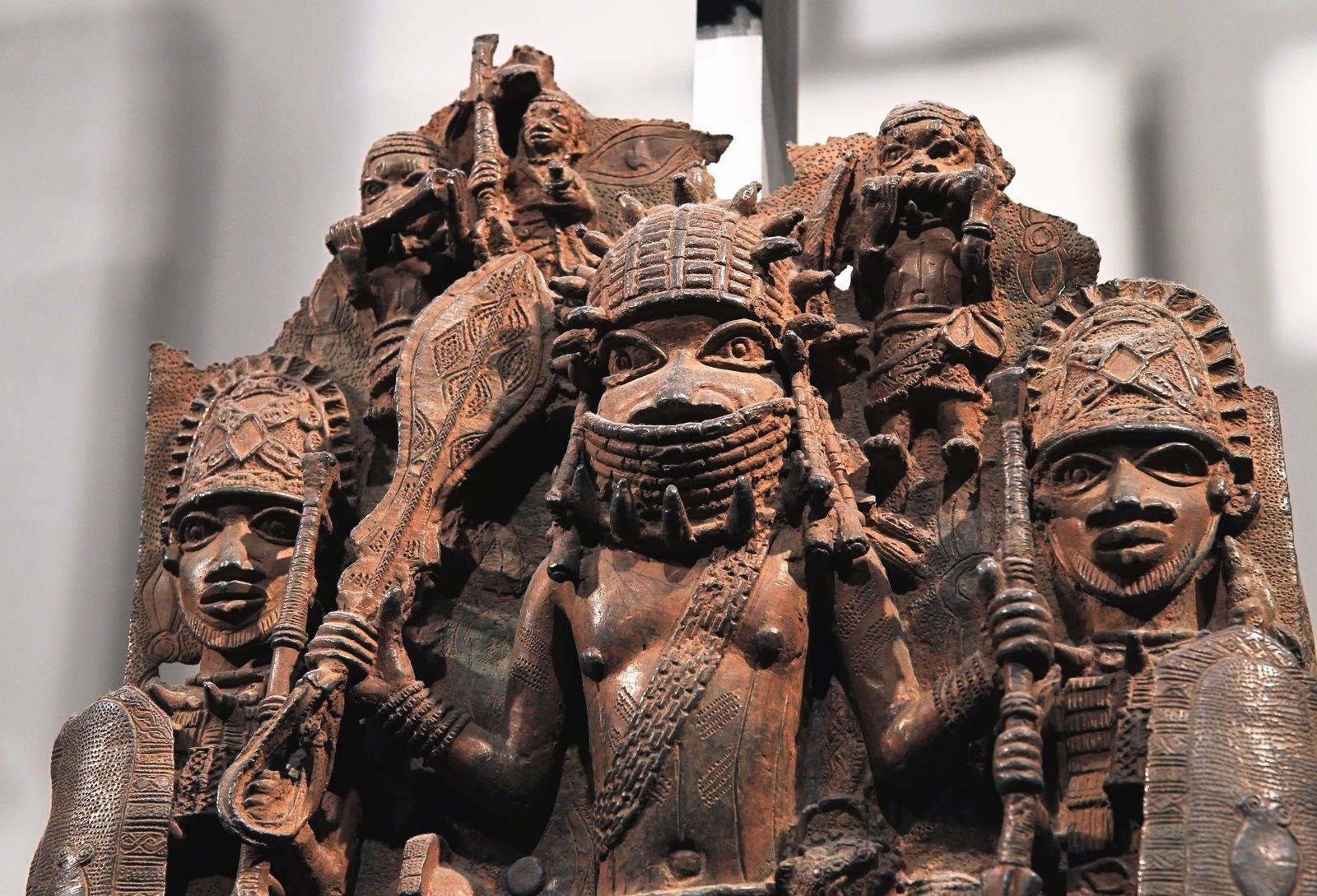 A cast brass plaque from Benin City showing figures of court officials in high relief