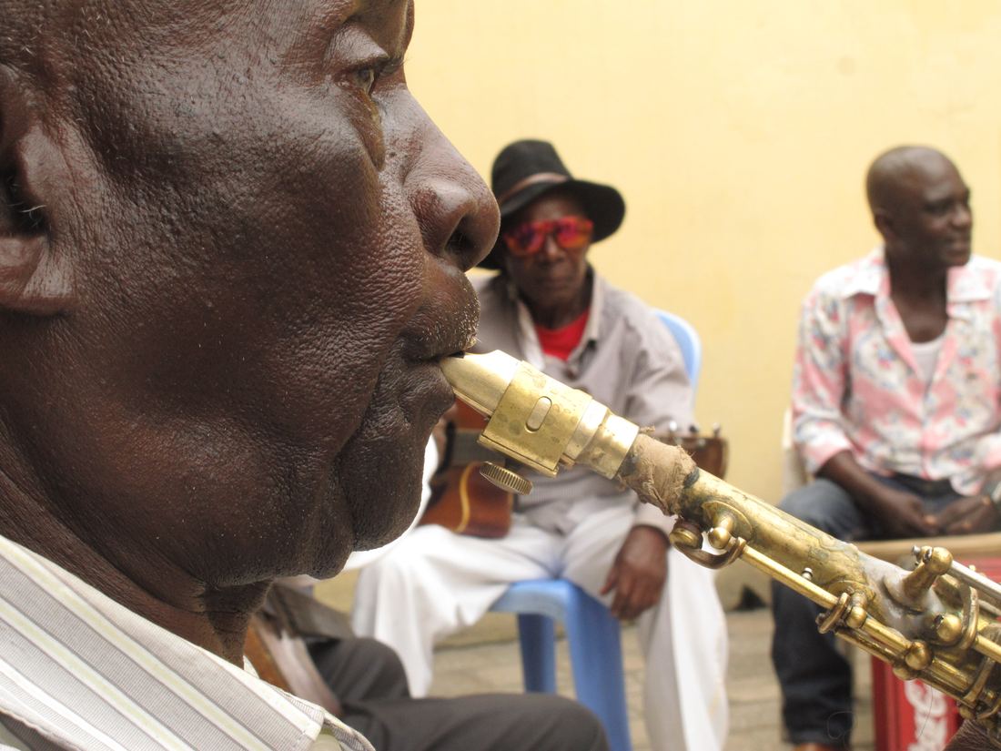 A saxophonist of Bakolo Music International playing during a rehearsal in Kinshasa