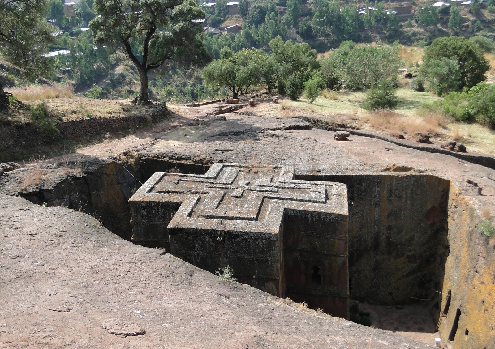 The cross-shaped roof of the Church of Saint George, carved into a pit of red rock in Lalibela, Ethiopia
