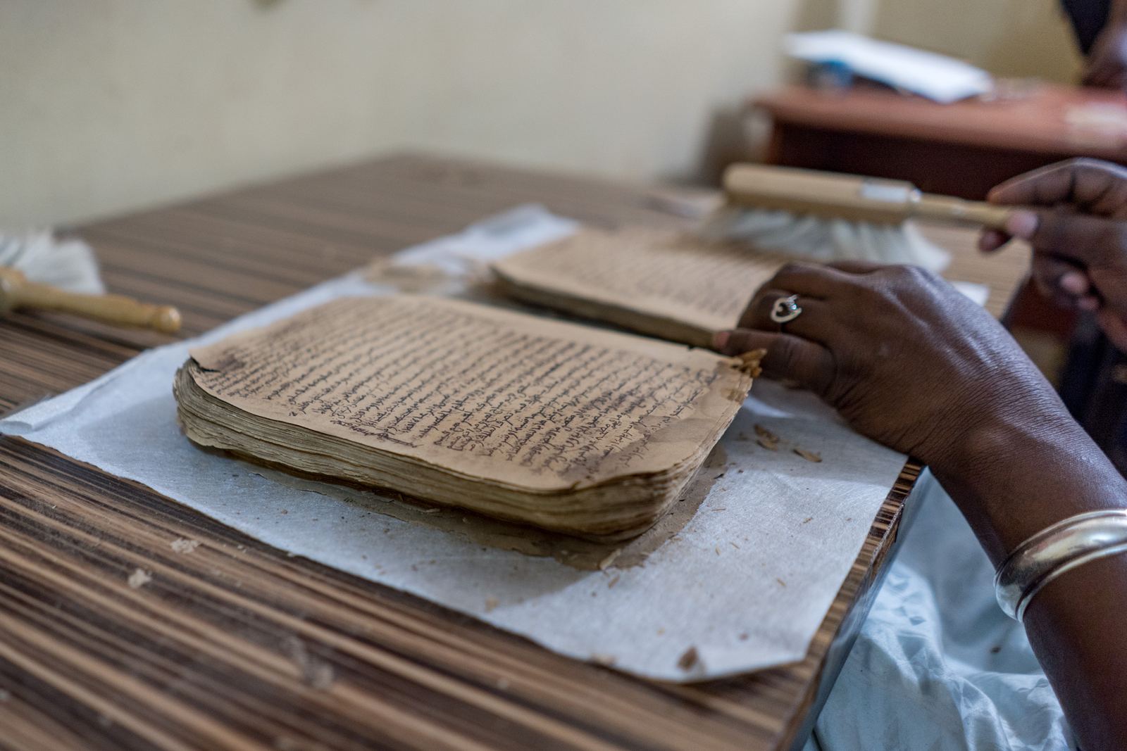 An open handwritten Arabic manuscript from Timbuktu with brown ink and decorated margins